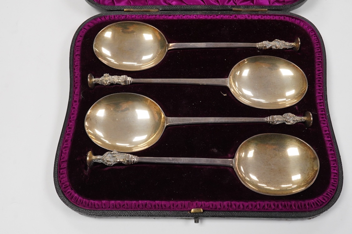 A late Victorian cased set of four silver apostle serving spoons, by Wakely & Wheeler, London, 1890, 19.6cm, 6.5oz.